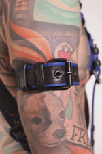 Model wearing a 1.5" black and blue leather armband belt