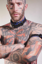 Model wearing a 1.5" black and blue leather pup collar