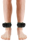 ARMY OF MEN 2.25" wide ANKLE RESTRAINTS - Army Green with matte black hardware styled on a male model, facing forward.