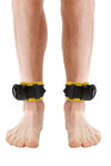 Front view of male model in a pair of 2.25" wide ARMY OF MEN black and yellow leather restraints with matte black hardware.