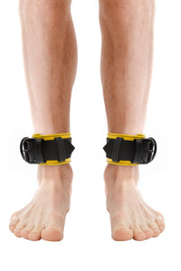 Front view of male model in a pair of 2.25" wide ARMY OF MEN black and yellow leather restraints with matte black hardware.