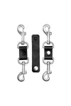 Two veg tan leather and stainless steel restraint connectors, laid flat and pictured with a veg tan leather connecting strap.