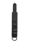 ARMY OF MEN 2.25" wide WRIST RESTRAINTS - Black with matte black rivets, buckle, and D-ring, laid flat and shot from above.
