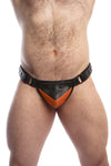 Male model facing forward wearing a quality ARMY OF MEN orange and black leather Chevron thong with matte black hardware.