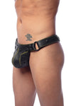 Male model turned slightly in a handmade ARMY OF MEN COMBAT THONG - Army Green with matte black O-rings.