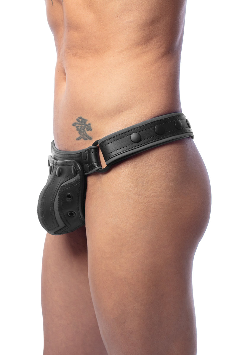 ARMY OF MEN COMBAT THONG - Grey with matte black metal hardware, styled on a tattooed model, seen in side profile.