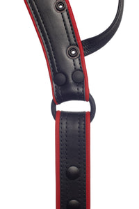 Overhead view of a handmade ARMY OF MEN COMBAT THONG - Red with matte black rivets, snaps, and O-rings.