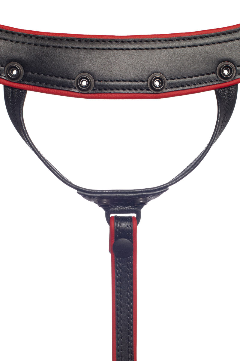 Front view of an ARMY OF MEN handcrafted black and red leather Combat thong with matte black hardware.