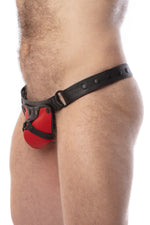 Model wearing a black leather thong with a red harness codpiece. Matt black hardware. Side view.