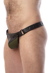 Model wearing a black leather thong with an army green shadow codpiece. Matt black hardware. Side view.