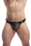 Model wearing a black leather thong with a grey shadow codpiece. Matt black hardware. Front view.