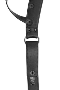 Product photo of a black leather and stainless steel thong lining.