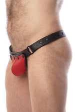 Model wearing a black leather thong with a red codpiece. Matt black hardware. Side view.