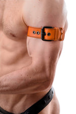 Model wearing an orange leather armband belt