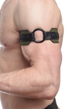 Model wearing an army green leather armband with black metal O-ring