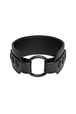 Black leather armband with black metal O-ring. 