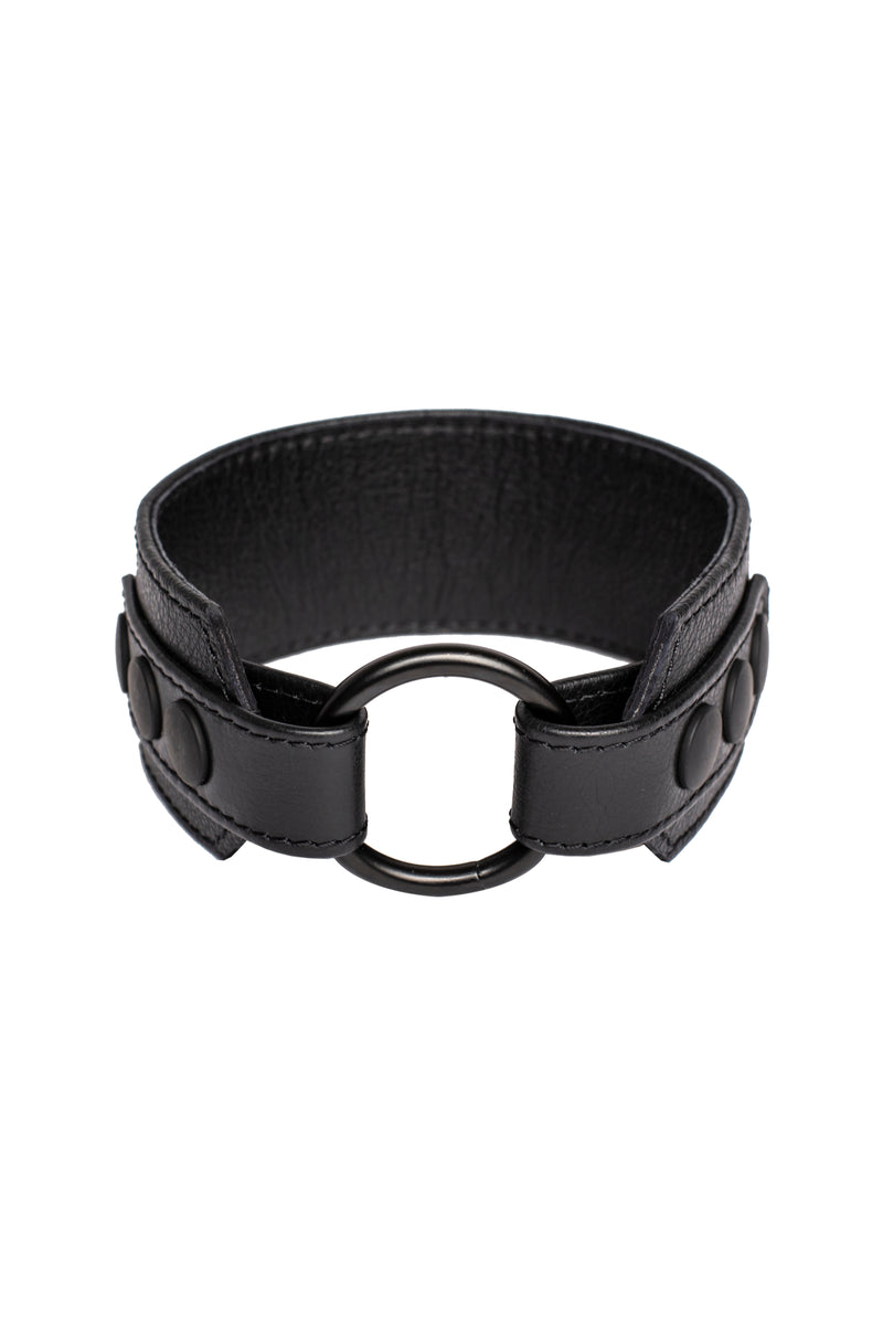 Black leather armband with black metal O-ring. 