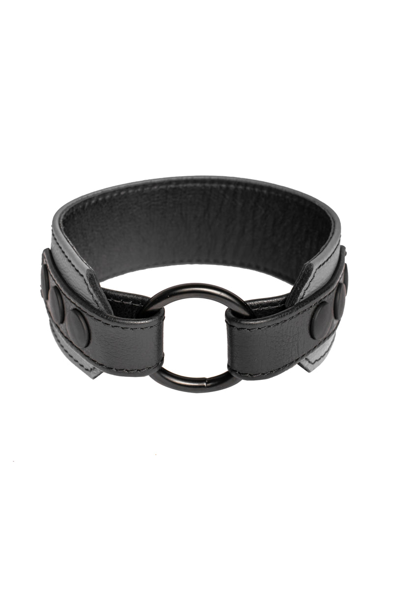 A grey leather armband with black metal O-ring