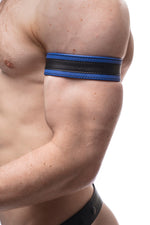 Model wearing a 1.5" blue leather armband with black racing stripe detail