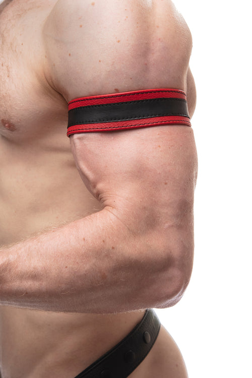 Model wearing a 1.5" red leather armband with black racing stripe detail.