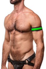 Model wearing a 1.5" wide black leather armband with fluro green leather racer stripe