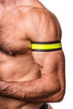 Model wearing a 1.5" wide black leather armband with fluro yellow leather racer stripe