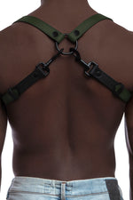 Model wearing army green and black leather braces with black metal hardware. Back view.