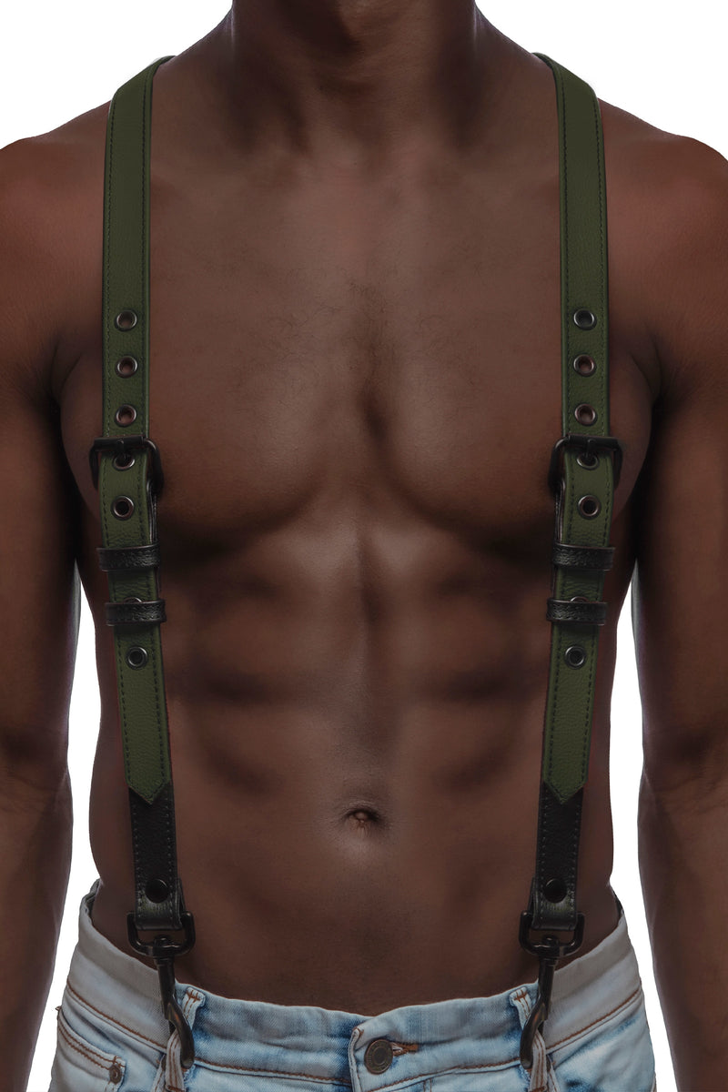Model wearing army green and black leather braces with black metal hardware attached to jeans.