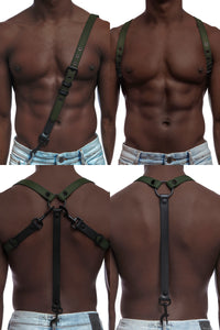 Model wearing army green and black leather braces with black metal hardware attached to jeans.