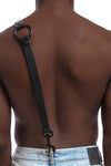 Model wearing black leather braces with black metal hardware attached to jeans. Black 2.