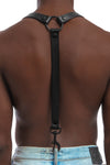 Model wearing black leather braces with black metal hardware attached to jeans. Back 1.