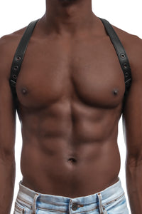 Model wearing black leather braces with black metal hardware as shoulder harness. Front 3.