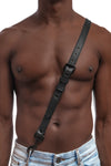 Model wearing black leather braces with black metal hardware attached to jeans. Front 2.
