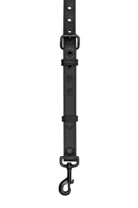 Model wearing black leather braces with black metal hardware attached to jeans. Back 1.