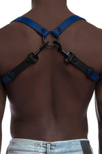 Model wearing blue and black leather braces with black metal hardware. Back view.