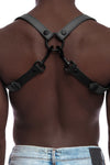 Model wearing grey and black leather braces with black metal hardware attached to jeans. Back view.