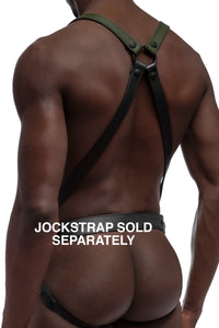 Model wearing army green and black leather braces kit with black metal hardware attached to leather jock. Back view.