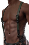 Model wearing army green and black leather braces kit with black metal hardware attached to leather jock. Front view.