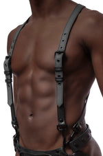 Model wearing grey and black leather braces kit with black metal hardware attached to leather jock. Front view.