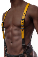 Model wearing yellow and black leather braces kit with black metal hardware attached to leather jock. Front view.