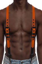 Model wearing orange and black leather braces with black metal hardware attached to jeans. Front view.