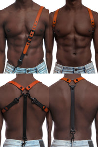Model wearing orange and black leather braces with black metal hardware attached to jeans.