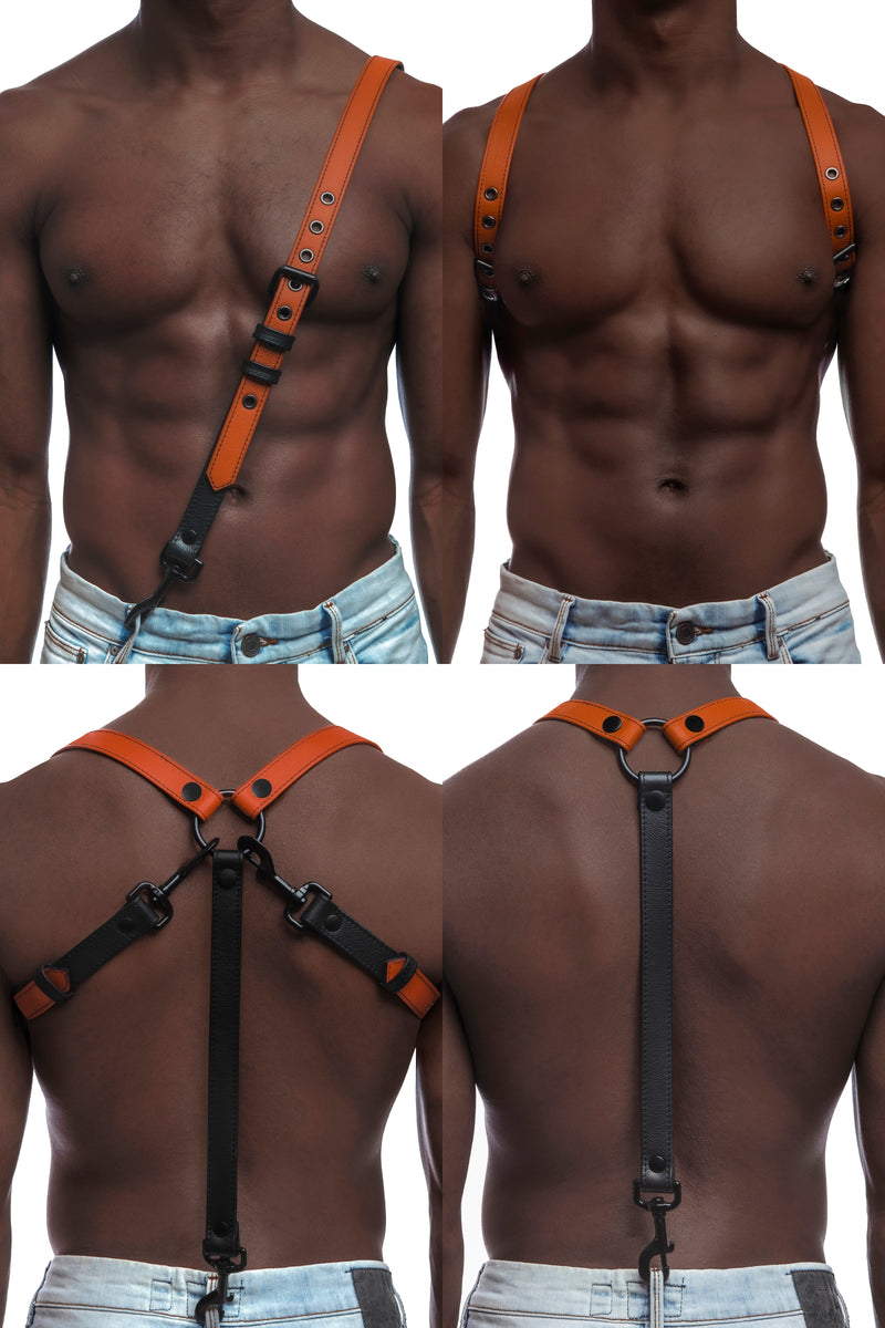 Model wearing orange and black leather braces with black metal hardware attached to jeans.