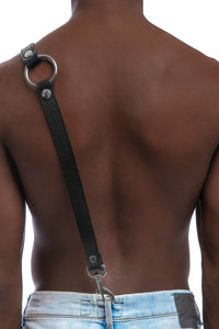 Model wearing black leather braces with stainless steel hardware attached to jeans. Black 2.