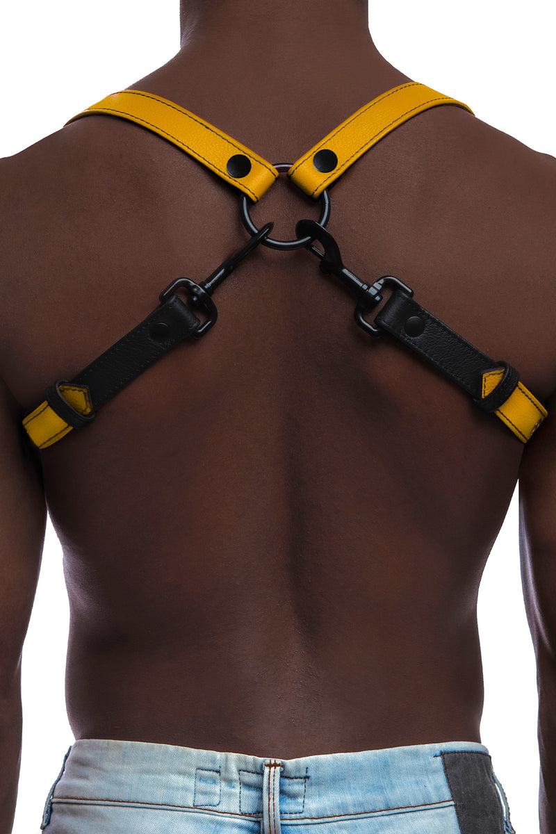 Model wearing yellow and black leather braces with black metal hardware. Back view.