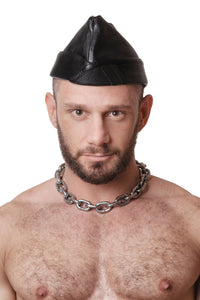 Model wearing black flight cap