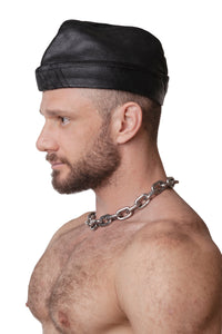 Model wearing black flight cap