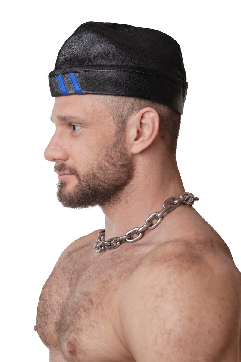 Model wearing black flight cap with blue stripes