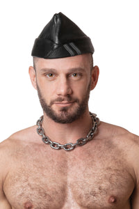 Model wearing black flight cap with grey stripes