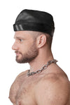 Model wearing black flight cap with grey stripes